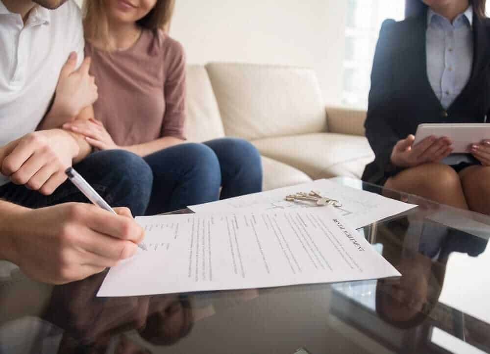 couple signing property contract