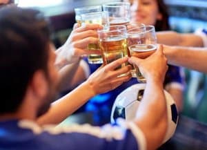 football team touch glasses after game