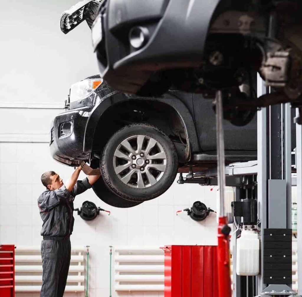 Car being repaired by mechanic