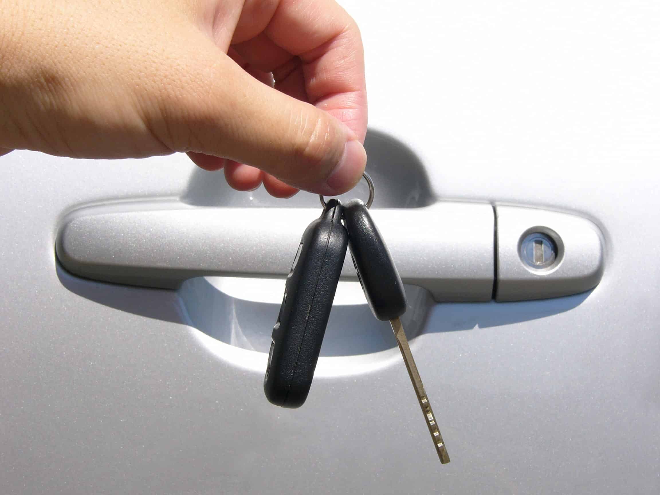 Hand holding car keys