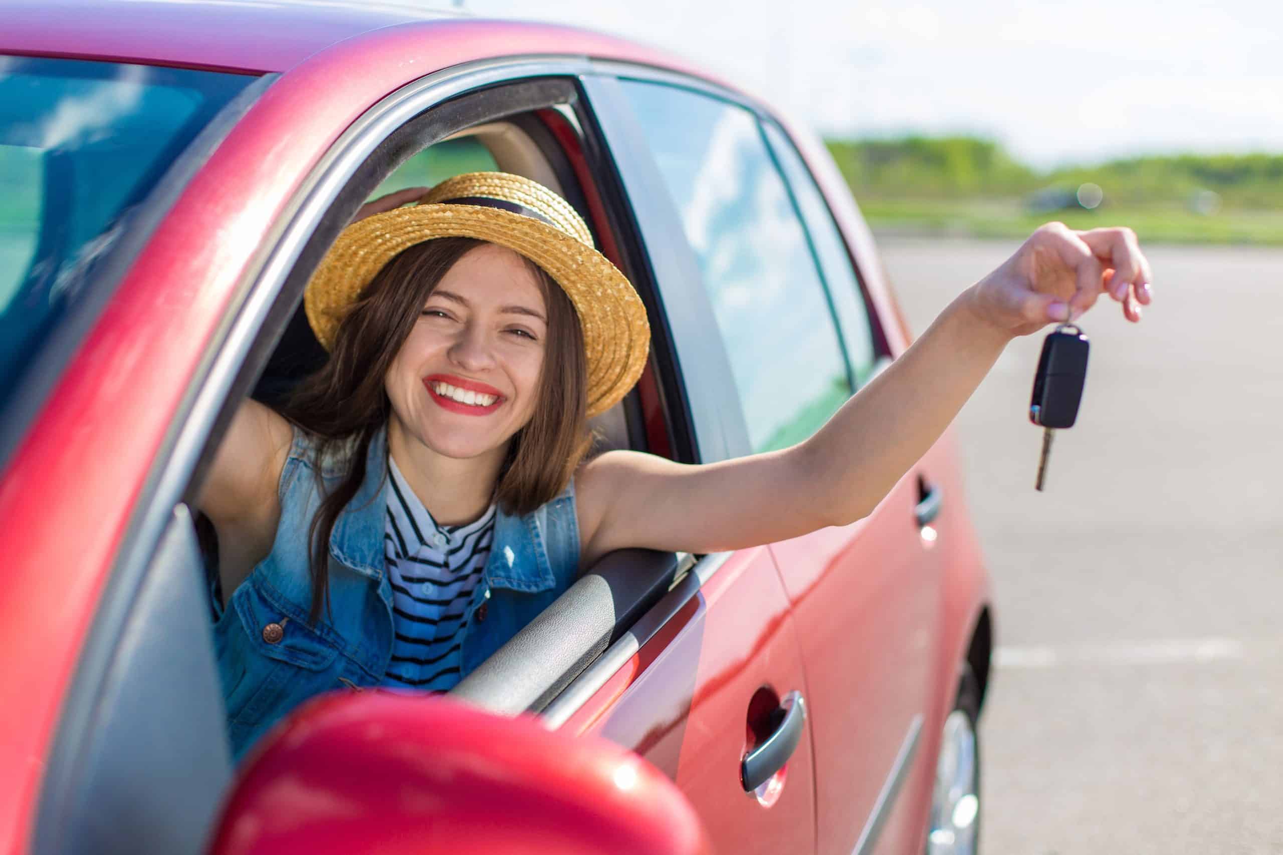 Woman in car smiling
