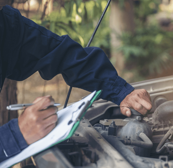 Mechanic looking under hood