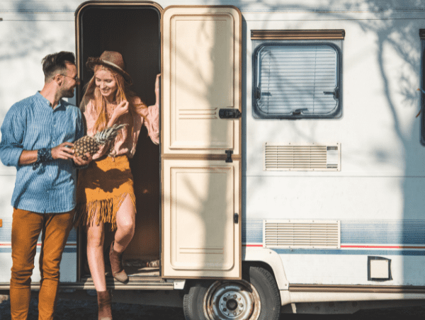 Couple in front of campervan