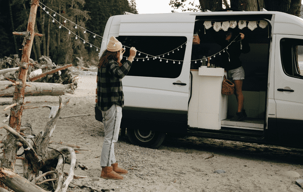 People setting up campervan